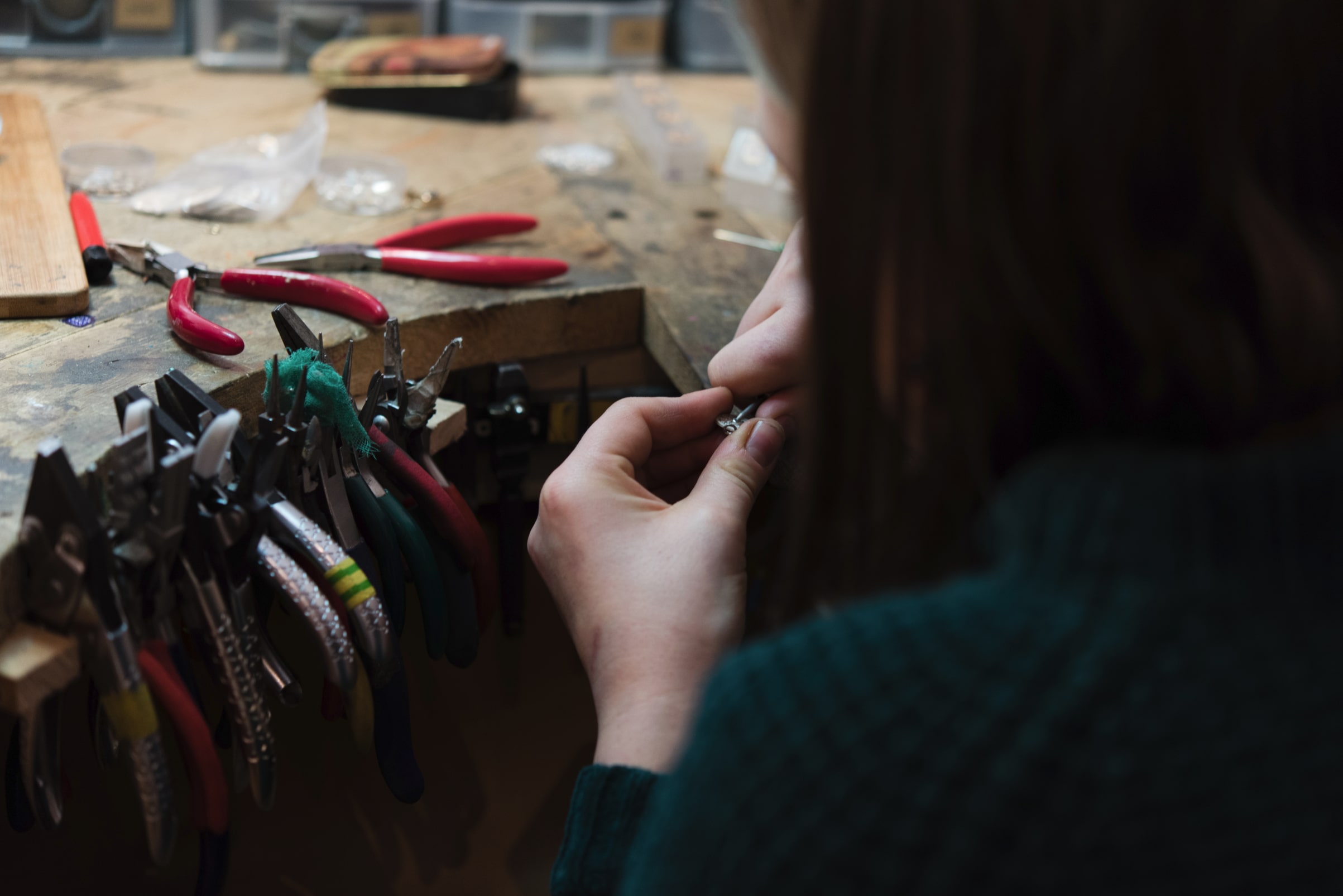 some jewellery pliers and some jewellery being inspected