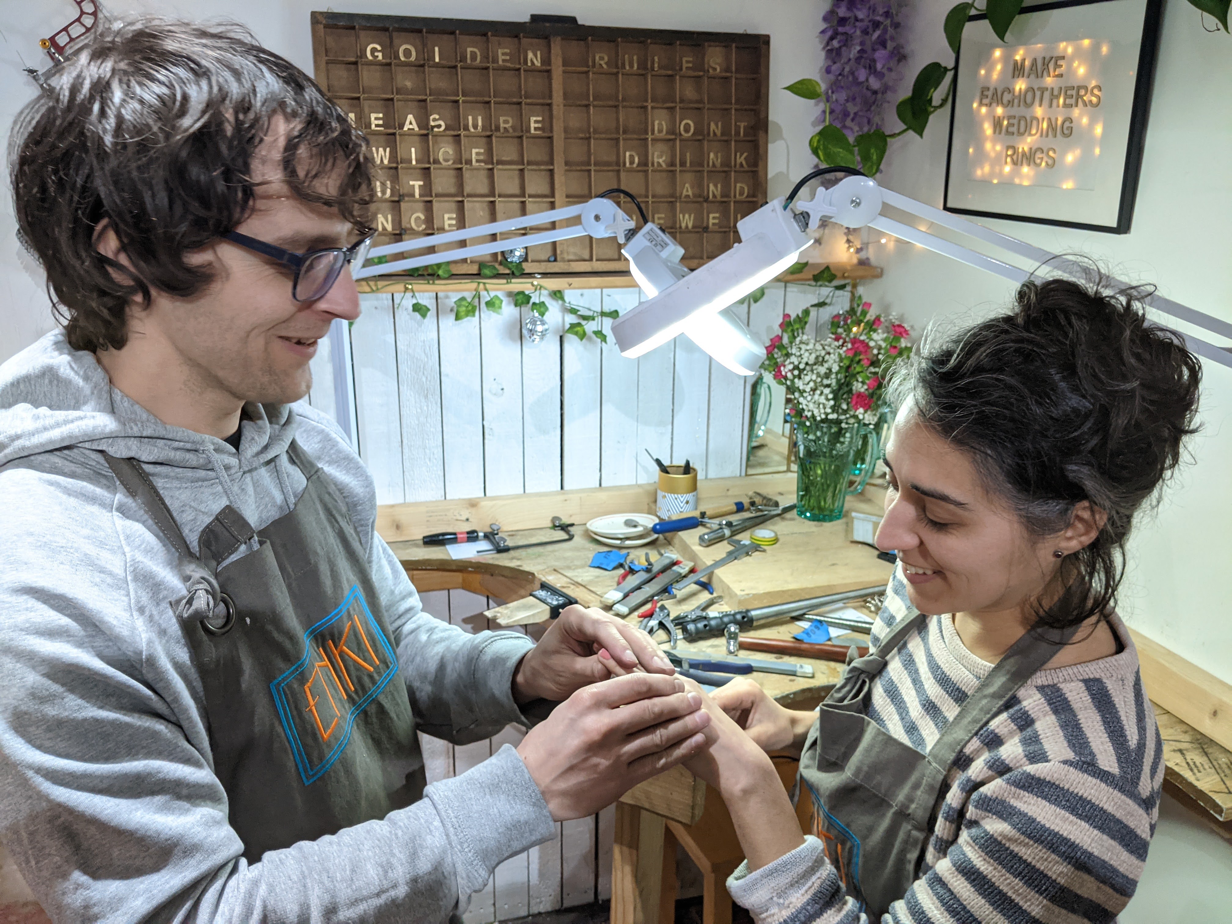 a couple enjoying their finished rings
